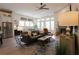 Open concept living room with ample natural light, fireplace, and modern furnishings at 330 Carriage Glen Ln, Woodstock, GA 30188