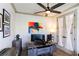Well-lit home office featuring modern desk setup, artistic decor, and natural light at 330 Carriage Glen Ln, Woodstock, GA 30188