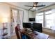Bright office space with a ceiling fan, dual monitors, and a comfortable work environment at 330 Carriage Glen Ln, Woodstock, GA 30188