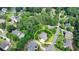 Aerial view of a beautiful home surrounded by mature trees in a quiet neighborhood at 12130 Helleri Holw, Alpharetta, GA 30005