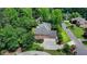 Aerial view of a two-story brick home with an attached two-car garage and a well-manicured lawn at 12130 Helleri Holw, Alpharetta, GA 30005