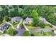 Picturesque aerial view of the home nestled among lush greenery in a desirable neighborhood at 12130 Helleri Holw, Alpharetta, GA 30005