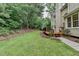 Expansive backyard with lush greenery and a deck, ideal for outdoor activities and entertaining at 12130 Helleri Holw, Alpharetta, GA 30005