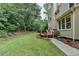 Lush backyard featuring a well-manicured lawn and private deck, perfect for outdoor enjoyment at 12130 Helleri Holw, Alpharetta, GA 30005