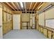Unfinished basement with exposed beams, offering a blank canvas for customization and storage at 12130 Helleri Holw, Alpharetta, GA 30005