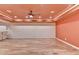 Expansive basement space with recessed lighting, hardwood floors, and neutral paint, ready for customization at 12130 Helleri Holw, Alpharetta, GA 30005