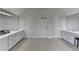 This bathroom offers large vanities with lots of storage plus many doors at 12130 Helleri Holw, Alpharetta, GA 30005