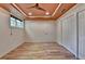 Bedroom showcasing hardwood floors, a ceiling fan, and a bright window at 12130 Helleri Holw, Alpharetta, GA 30005