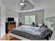 Comfortable bedroom featuring a ceiling fan and natural light at 12130 Helleri Holw, Alpharetta, GA 30005