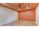 Bedroom featuring hardwood floors, a ceiling fan, and ample closet space at 12130 Helleri Holw, Alpharetta, GA 30005