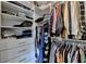 Walk-in closet with shelving and hanging storage at 12130 Helleri Holw, Alpharetta, GA 30005