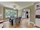 Chic dining area with backyard views, and access to the living room and wet bar at 12130 Helleri Holw, Alpharetta, GA 30005