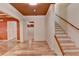 Spacious living room with hardwood floors, a staircase, and neutral walls creating a welcoming atmosphere at 12130 Helleri Holw, Alpharetta, GA 30005