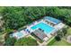 A stunning community pool with lounge chairs, a spa, and a basketball court surrounded by lush greenery at 12130 Helleri Holw, Alpharetta, GA 30005