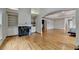Sitting area with hardwood floors, a fireplace, built-in shelves, and is connected to the main bedroom at 12130 Helleri Holw, Alpharetta, GA 30005