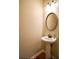 This bathroom features a pedestal sink, framed mirror, and updated fixtures at 1668 Sabastian Ne Pt, Atlanta, GA 30329