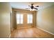 This bedroom has shutters on the windows, a ceiling fan, and wood floors at 1668 Sabastian Ne Pt, Atlanta, GA 30329
