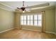 Bright bedroom with hardwood floors, neutral paint, and a ceiling fan at 1668 Sabastian Ne Pt, Atlanta, GA 30329