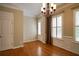 Dining area with chair rail and trim, wood floors, and light filled windows with blinds at 1668 Sabastian Ne Pt, Atlanta, GA 30329