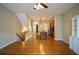 Open-concept living space featuring hardwood floors, a kitchen island, and ample natural light at 1668 Sabastian Ne Pt, Atlanta, GA 30329