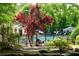 Community pool view shows secure black fence, lounge chairs, and a bath house at 1668 Sabastian Ne Pt, Atlanta, GA 30329