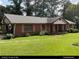 Charming single-story brick home featuring shuttered windows, covered carport, and a cozy front porch at 2969 Favor Sw Rd, Marietta, GA 30060