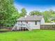 View of the spacious backyard with a white wooden deck perfect for outdoor relaxation and entertaining at 394 Thornbrooke Dr, Hiram, GA 30141