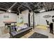 Basement living area with game room, comfortable sofa, and storage at 394 Thornbrooke Dr, Hiram, GA 30141
