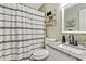 Well-lit bathroom with granite counters and sleek black hardware at 394 Thornbrooke Dr, Hiram, GA 30141