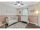 Bright Bedroom with soft rug, white furnishings, and calming decor at 394 Thornbrooke Dr, Hiram, GA 30141