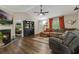 Cozy living room featuring a fireplace, hardwood floors, and an open layout for entertaining at 394 Thornbrooke Dr, Hiram, GA 30141