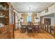 Elegant dining room with classic wood furniture, chandelier lighting, and hardwood floors at 480 Pineburr Ln, Stone Mountain, GA 30087