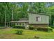 Charming two-story home with a large front yard and mature trees providing ample shade at 480 Pineburr Ln, Stone Mountain, GA 30087