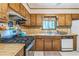 This home offers a practical kitchen space featuring wood cabinets and stainless steel appliances at 480 Pineburr Ln, Stone Mountain, GA 30087