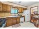 Functional kitchen with wood cabinets and modern appliances, seamlessly blending style and convenience at 480 Pineburr Ln, Stone Mountain, GA 30087