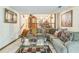 Inviting living room with comfortable seating, a decorative glass table and access to the dining room at 480 Pineburr Ln, Stone Mountain, GA 30087