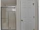 Bathroom featuring glass shower, tile flooring and white door at 525 Hunnicutt Se Rd, Mableton, GA 30126