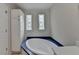 Bathroom featuring soaking tub, decorative windows and neutral wall color at 525 Hunnicutt Se Rd, Mableton, GA 30126