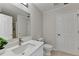 Bathroom featuring white vanity, toilet and shower with glass doors at 525 Hunnicutt Se Rd, Mableton, GA 30126