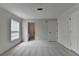 Bedroom featuring neutral colored walls, carpet, and door leading to bathroom at 525 Hunnicutt Se Rd, Mableton, GA 30126