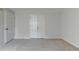 Spacious bedroom featuring neutral carpet, walls and closet at 525 Hunnicutt Se Rd, Mableton, GA 30126