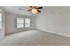 Spacious bedroom with plush carpeting, neutral walls, and large windows for natural light at 525 Hunnicutt Se Rd, Mableton, GA 30126