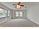 Spacious bedroom with plush carpeting, neutral walls, and large windows for natural light at 525 Hunnicutt Se Rd, Mableton, GA 30126