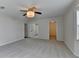 Large bedroom with plush carpet, neutral walls, and access to walk-in closet at 525 Hunnicutt Se Rd, Mableton, GA 30126