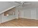 Bright bedroom featuring hardwood floors, white ceiling fan, and a neutral color scheme at 525 Hunnicutt Se Rd, Mableton, GA 30126