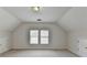 Bedroom featuring plush carpet, natural light, and storage space at 525 Hunnicutt Se Rd, Mableton, GA 30126