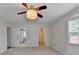 Large bedroom with plush carpet, neutral walls, and access to walk-in closet and ensuite bath at 525 Hunnicutt Se Rd, Mableton, GA 30126