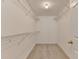 Walk-in closet with carpeted floor and wire shelving at 525 Hunnicutt Se Rd, Mableton, GA 30126