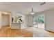 Open dining area featuring hardwood floors, access to the deck, and an adjacent breakfast bar at 525 Hunnicutt Se Rd, Mableton, GA 30126