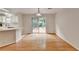 Bright dining area with hardwood floors and sliding glass doors leading to the outdoor deck at 525 Hunnicutt Se Rd, Mableton, GA 30126